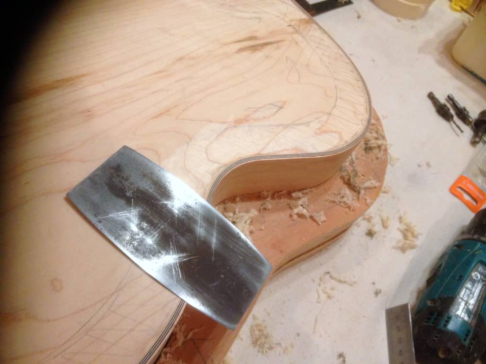 Scraping the re-curve on the maple back
