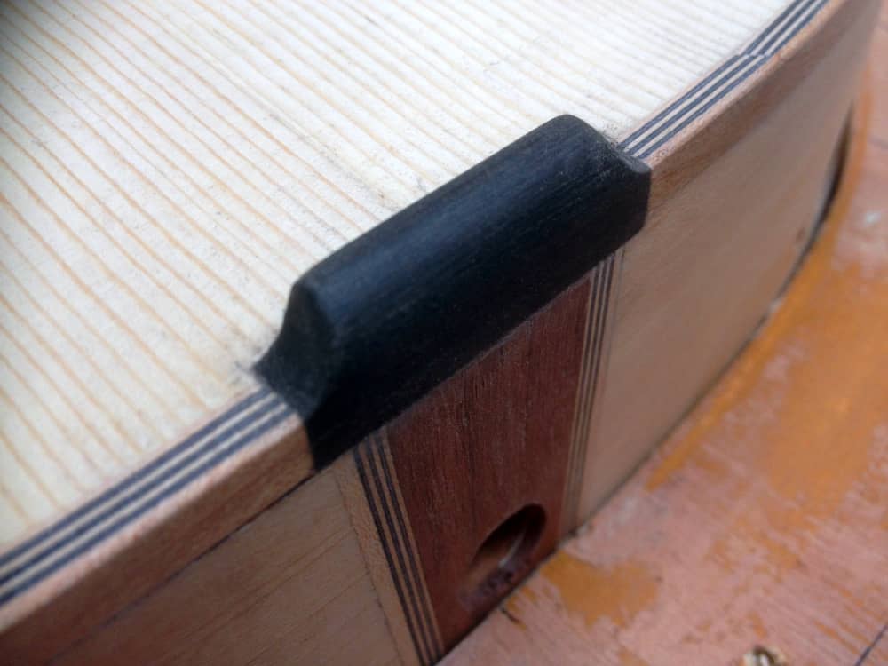 Ebony tailpiece saddle