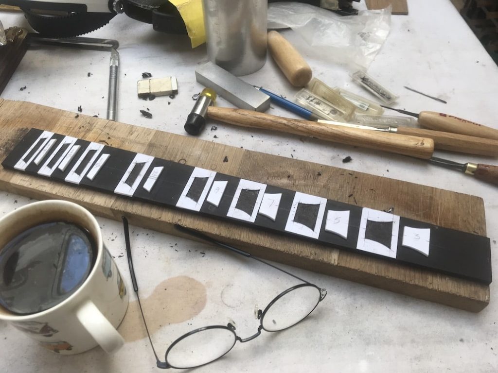 MOP inlays in an ebony fingerboard